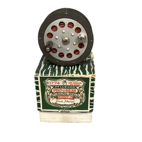 VINTAGE PFLUEGER PROGRESS No. 1774 FISHING REEL GUN METAL WITH ORIGINAL BOX - Picture 1 of 9